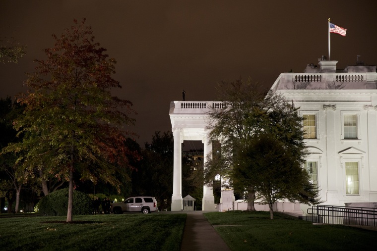 A group of Secret Service police gather on the North Lawn on Oct. 22, 2014, in Washington. (Photo by Jacquelyn Martin/AP)