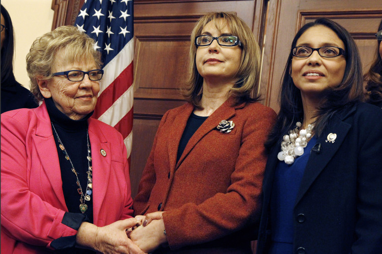 Former U.S. Rep. Gabrielle Giffords, center, of Arizona, poses for photographs with New Jersey Assemblywoman Gabriela Mosquera, right, D-Turnersville, N.J., and state Sen. Loretta Weinberg, left, D-Teaneck, N.J., after a meeting on March 18, 2015.