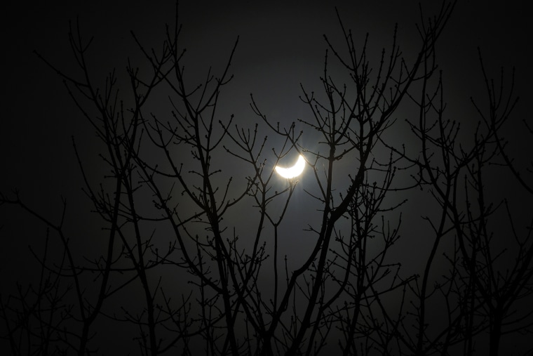 The moon passes infront of the Earth's star marking the begining of a total eclipse, the only one this year, in Vigo, northwestern Spain on March 20, 2015. (Photo by Miguel Riopa/AFP/Getty)