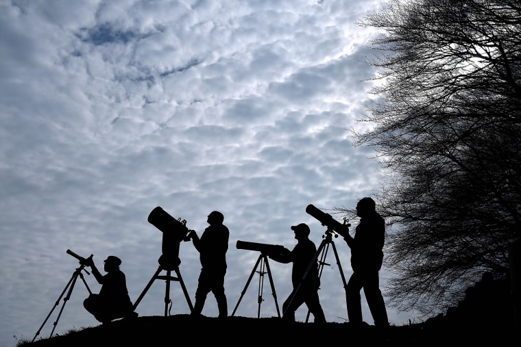 Members of the Galloway Forest Astronomical Society prepare their equipment ahead of tomorrows solar eclipse on March 19, 2015 in Newton Stewart, Scotland. (Photo by Jeff J Mitchell/Getty)