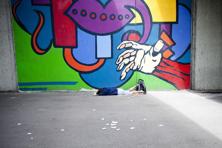 A homeless woman sleeps under the 16th Street bridge in Boise, Idaho on June 25, 2014. (Photo by Kyle Green/The Idaho Statesman)