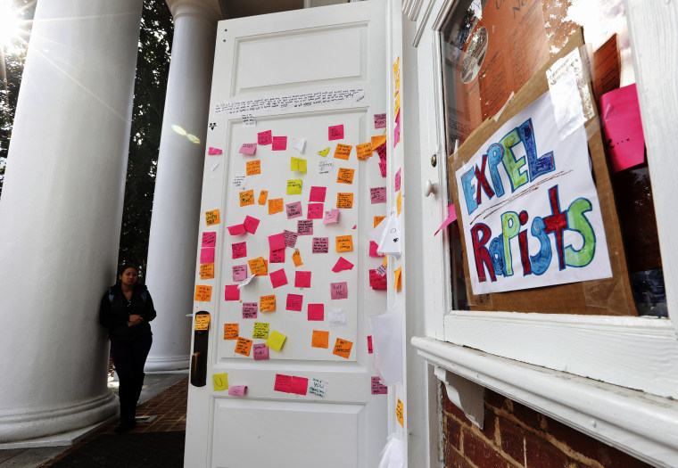 Postings on the door of Peabody Hall related to the Phi Kappa Psi gang rape allegations at the University of Virginia in Charlottesville, Va., Nov. 24, 2014. (Photo by Steve Helber/AP)
