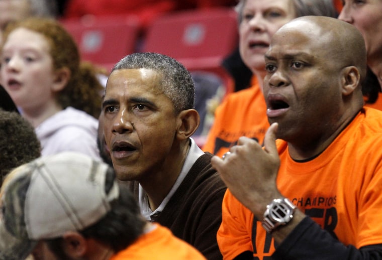 US President Barack Obama attends the game between Princeton and Green Bay for the 2015 Women's NCAA Basketball Tournament in College Park, Md., March 21, 2015. Obama's niece Leslie Robinson plays for Princeton. (Photo by Yuri Gripas/Reuters)