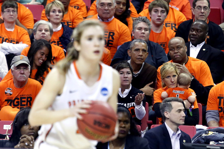 US President Barack Obama attends the game between Princeton and Green Bay for the 2015 Women's NCAA Basketball Tournament in College Park, Md., March 21, 2015. Obama's niece Leslie Robinson plays for Princeton. (Photo by Yuri Gripas/Reuters)