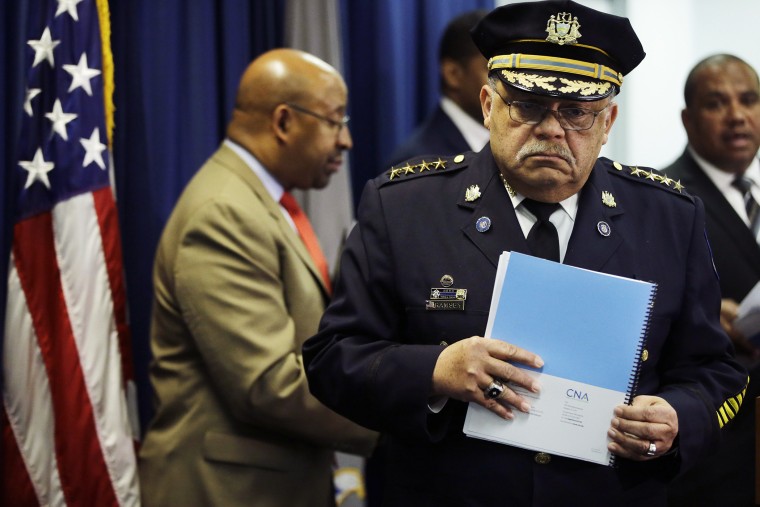 Philadelphia Police Commissioner Charles Ramsey holds a newly released report during a news conference on March 23, 2015, in Philadelphia. (Photo by Matt Rourke/AP)