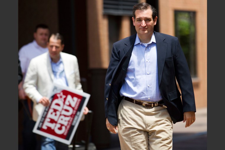 Ted Cruz, Republican candidate for U.S. Senate, walks to a news conference, the day after defeating Lt. Gov. David Dewhurst in a runoff primary election,...