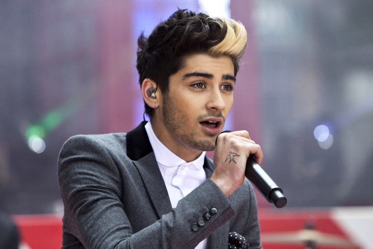 Zayn Malik performs with his band \"One Direction\" on NBC's Today show in New York on Nov. 13, 2012. (Photo by Andrew Burton/Reuters)
