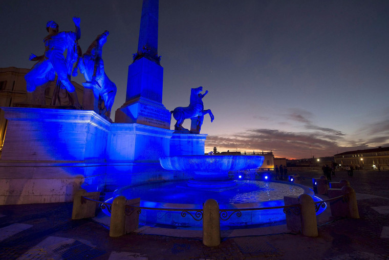 A handout picture released by the Italian presidency press office showing a profile of the Dioscuri's fountain, in front of Quirinale Palace, illuminated in blue for the 'World Day of Awareness of Autism' in Rome, Italy, on April 1, 2015.