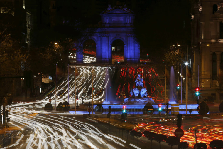 A night scene showing Cibeles fountain (C) and Puerta de Alcala (Backgroung) illuminated in blue for the 'World Day of Awareness of Autism' in Madrid, Spain, on April 1, 2015.