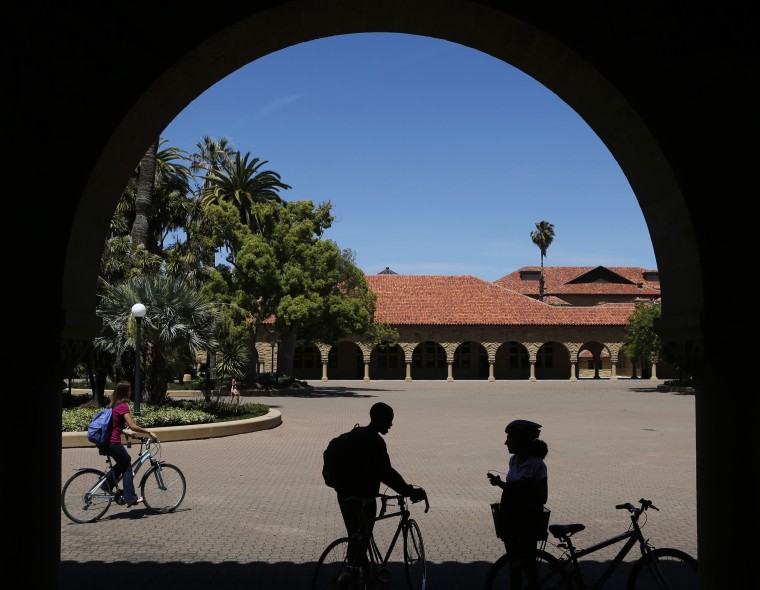 Students retrieve their bicycles after leaving a class, at the Main Quad at Stanford University in Stanford, Calif., May 9, 2014. (Photo by Beck Diefenbach/Reuters)