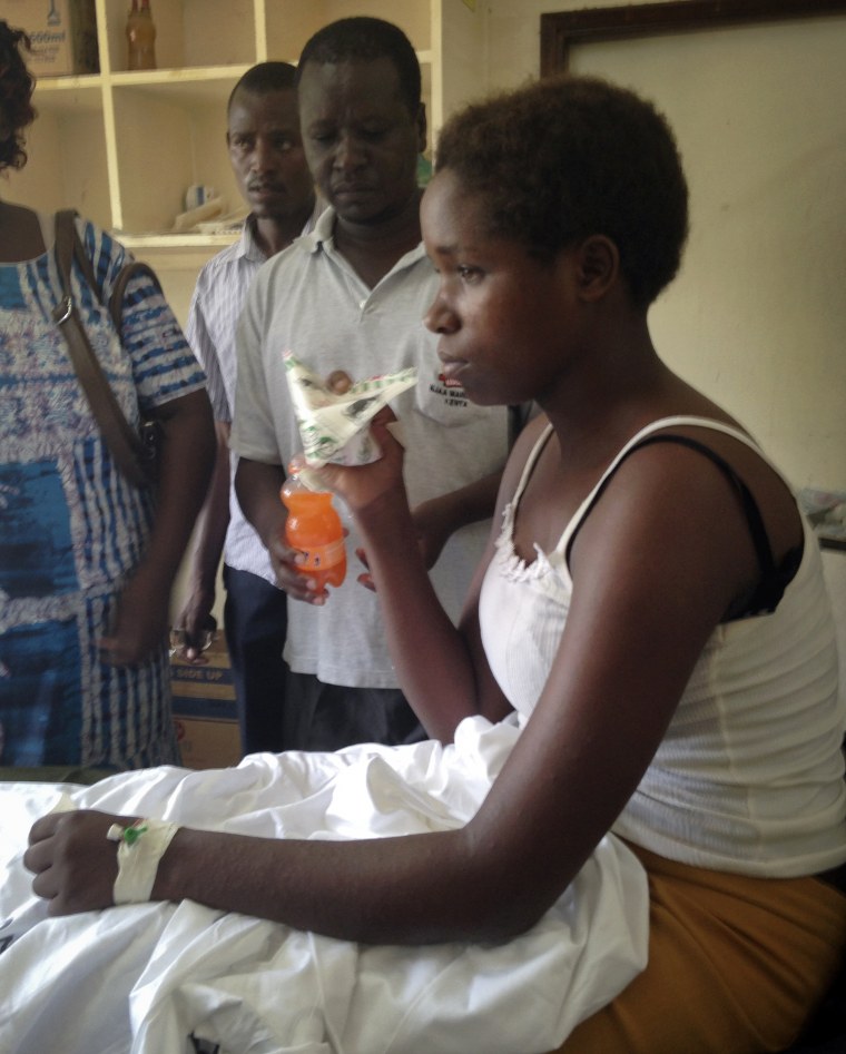Survivor of the killings at Garissa University College Cynthia Cheroitich, 19, who was found on Saturday two days after the attack, drinks some milk in a hospital ward in Garissa, Kenya, April 4, 2015. (Photo by Christopher Torchia/AP)