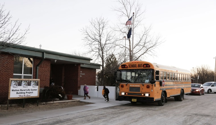 Students arrive at the Walton Rural Life Center Elementary School, in Walton, Kan., Jan. 18, 2013. (Photo by Jeff Tuttle/Reuters)