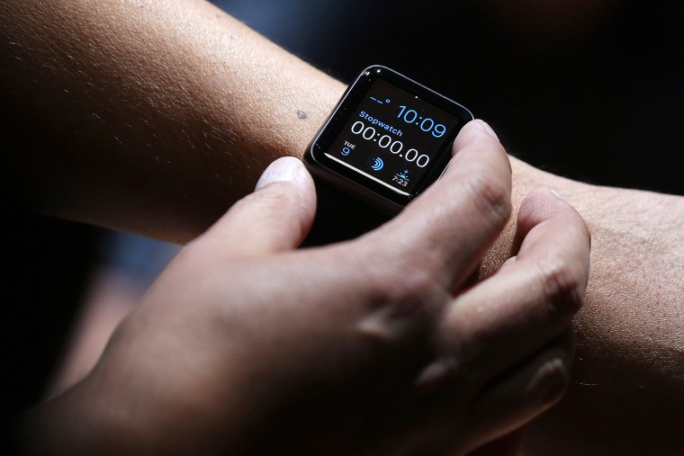 An attendee inspects the new Apple Watch during an Apple special event at the Flint Center for the Performing Arts on September 9, 2014 in Cupertino, Calif. (Photo by Justin Sullivan/Getty)