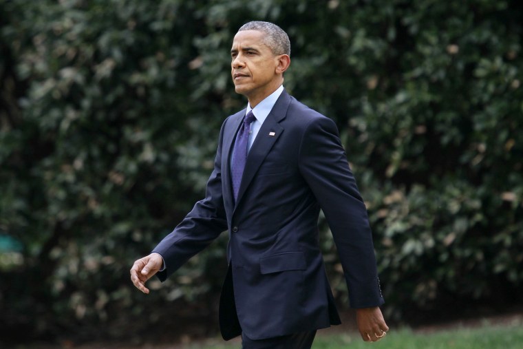 President Barack Obama walks from the Oval Office of the White House in Washington on April 8, 2015.