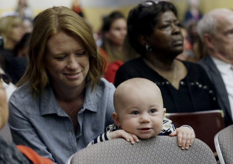 Jennifer Wonnacott, a supporter of a measure requiring California schoolchildren to get vaccinated, keeps an eye on her son, Gavin, at a hearing at the Capitol in Sacramento, Calif., April 8, 2015. (Photo by Rich Pedroncelli/AP)