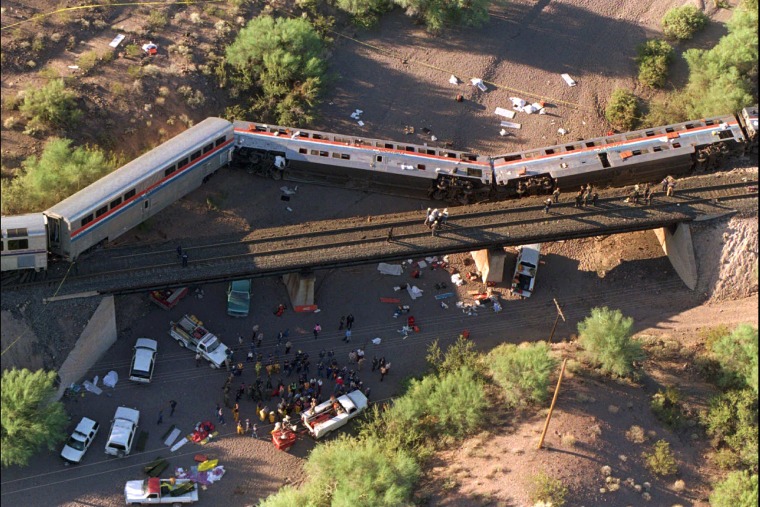 An Amtrak Sunset Limited train lies on its side in a creek bed after derailing 55 miles southwest of Phoenix near Hyder, Ariz., Oct. 9, 1995. (Photo by Scott Troyanos/AP)