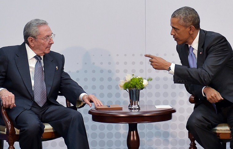 US President Barack Obama speaks with Cuba's President Raul Castro on the sidelines of the Summit of the Americas at the ATLAPA Convention center on April 11, 2015 in Panama City. (Photo by Mandel Ngan/AFP/Getty)