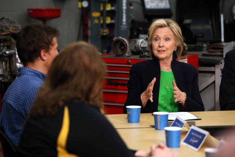 Democratic presidential hopeful and former Secretary of State Hillary Clinton (R) speaks during a roundtable discussion with students and educators on April 14, 2015 in Monticello, Iowa. (Photo by Justin Sullivan/Getty)