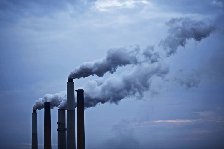 Emissions from a coal-fired power plant drift skyward in Ghent, Ky.