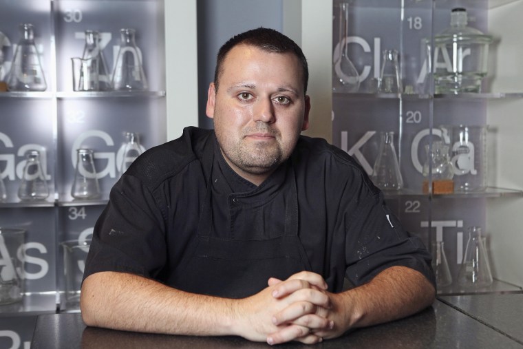 In this Nov. 7, 2013 photo Chef Homaro Cantu poses for a photo at his restaurant Moto in Chicago. (Photo by Chandler West/Sun-Times Media/AP)