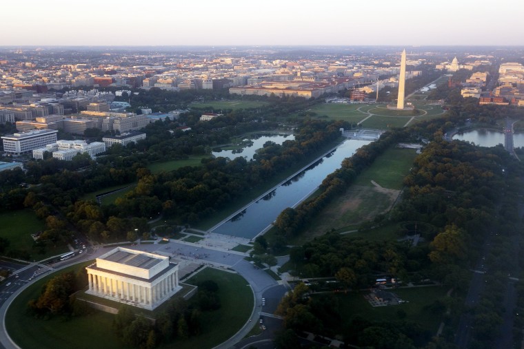 The skyline of Washington, D.C., including the Lincoln Memorial, Washington Monument, US Capitol and National Mall, is seen from the air at sunset in this photograph taken on June 15, 2014. (Photo by Saul Loeb/AFP/Getty)