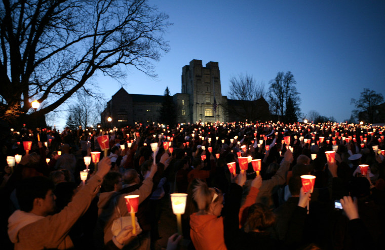 Students take part in a candlelight vigil a day after the killings at Virginia Tech in Blacksburg, Va., April 17, 2007. (Photo by Kevin Lamarque/Reuters)