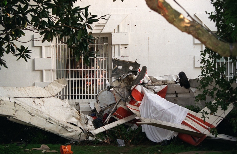 In this Sept. 12, 1994, file photo, the wreckage of a small single-engine plane lies next to the South Portico near the Rose Garden of the White House in Washington.