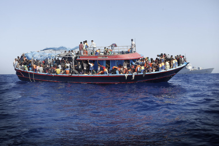 A boat of more than 900 illegal migrants after being rescued by an Italian naval vessel in the Mediterranean Sea on Sept. 12, 2014.