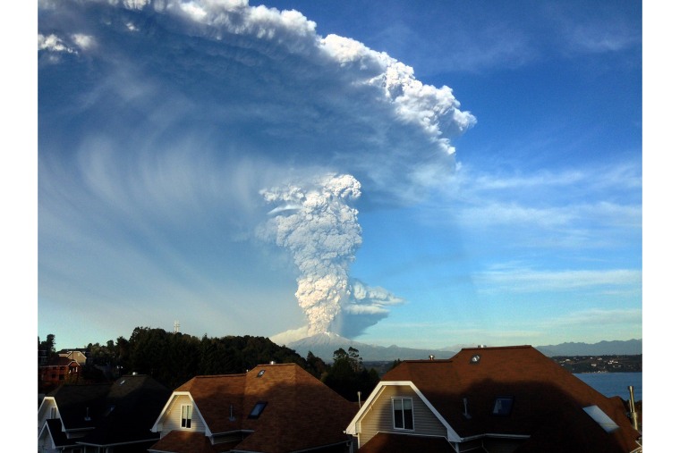 View from Puerto Varas, southern Chile, of a high column of ash and lava spewing from the Calbuco volcano, on April 22, 2015.