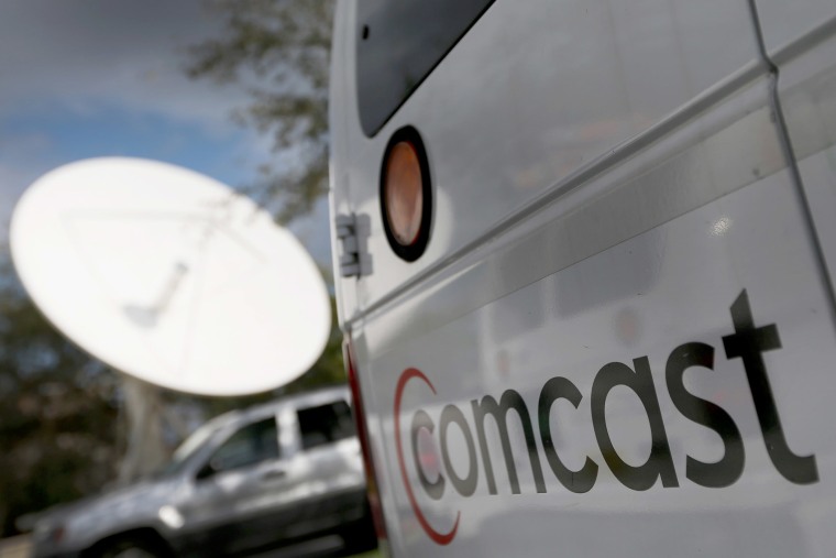 A Comcast truck is seen parked at one of their centers on Feb. 13, 2014 in Pompano Beach, Fla. (Photo by Joe Raedle/Getty)