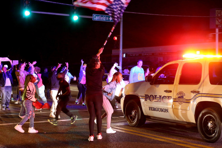 Protesters block the intersection of West Florissant Avenue and Canfield Drive in Ferguson, Mo., Tuesday night, April 28, 2015. (Photo by David Carson/St. Louis Post-Dispatch/AP)