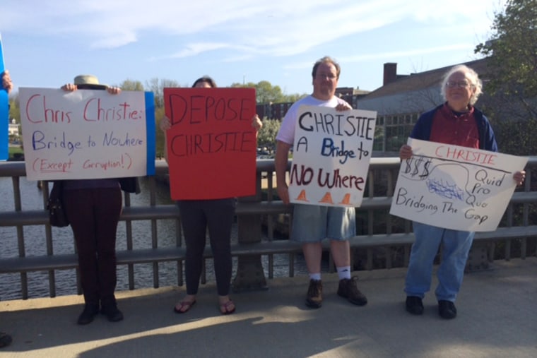 Protestors outside New Jersey Gov. Chris Christie's town hall meeting at Fury's Publick House in Dover, N.H., on May 8, 2015.