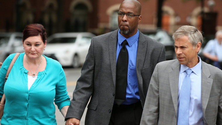 Former CIA officer Jeffrey Sterling, center, accompanied by his wife Holly, and his attorney, arrives at the U.S. District Court in Alexandria, Va., on May 11, 2015. (Photo by Andrew Harnik/AP)