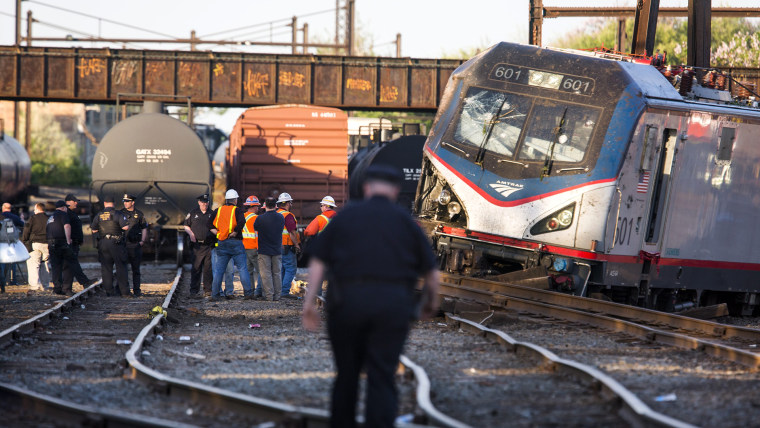 The remains of an Amtrak train that derailed on its way from Washington, D.C., to New York City are seen just outside Philadelphia, Pa., on May 13, 2015. (Photo by Jim Lo Scalzo/EPA)