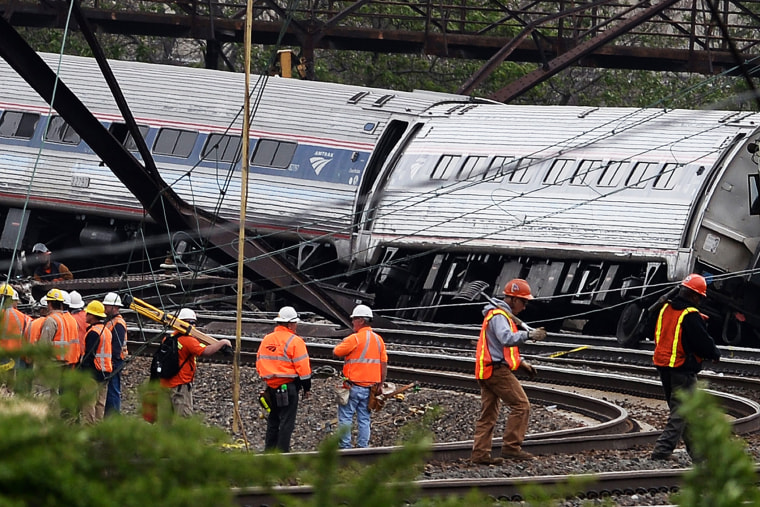 Rescuers work around derailed carriages of an Amtrak train in Philadelphia, Pa. on May 13, 2015. (Photo by Jewel Samad/AFP/Getty)