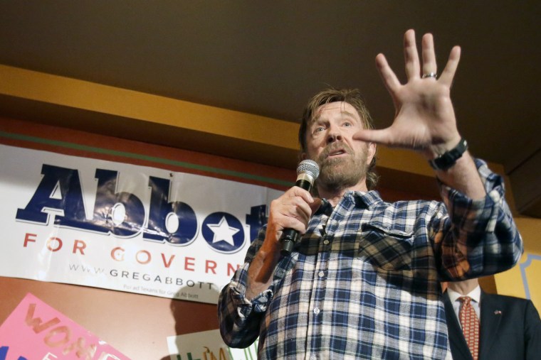 Martial arts star Chuck Norris gives a speech to introduce then, Texas Republican gubernatorial candidate Greg Abbott at a campaign event, Nov. 3, 2014, in Houston, Texas. (Photo by Pat Sullivan/AP)