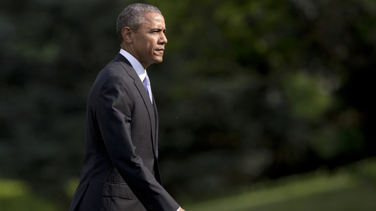 President Barack Obama walks across the South Lawn of the White House from Marine One, May 28, 2015, in Washington, D.C. (Photo by Carolyn Kaster/AP)