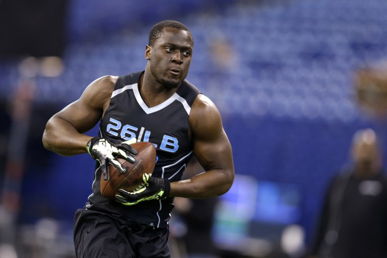 Notre Dame linebacker Prince Shembo runs a drill at the NFL football scouting combine in Indianapolis, Feb. 24, 2014. (Photo by Michael Conroy/AP)
