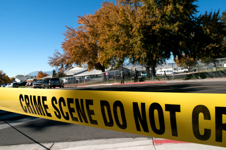 Police tape secures a crime scene on Oct. 21, 2013. (Photo by David Calvert/Getty)