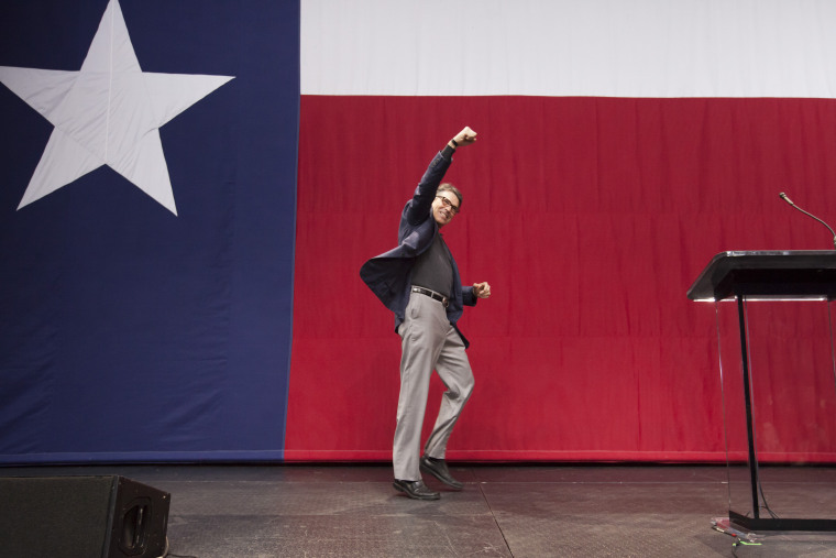 Gov. Rick Perry of Texas pumps a fist while taking the stage at an election night rally in Austin. (Photo by Michael Stravato/The New York Times/Redux)