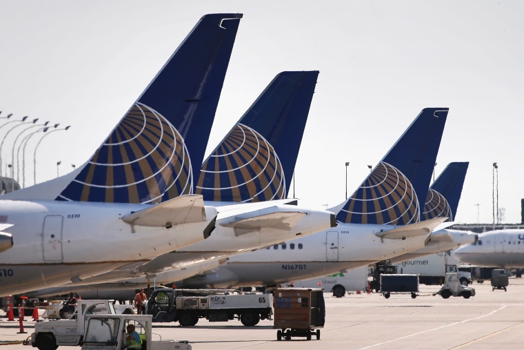 United Airlines jets sit at gates at O'Hare International Airport in Chicago, Ill. (Photo by Scott Olson/Getty)