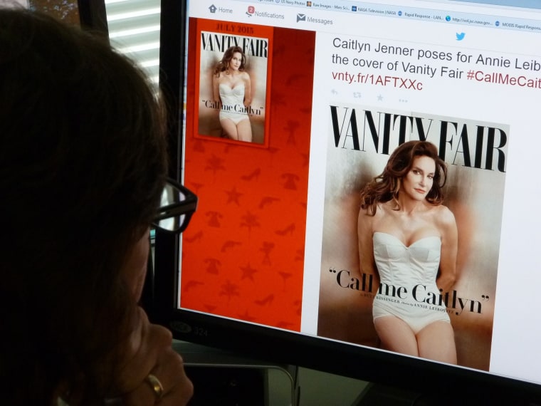 A journalist looks at Vanity Fair's Twitter site with the Tweet about Caitlyn Jenner, who will be featured on the July cover of the magazine. (Photo by Mladen Antonov/AFP/Getty)