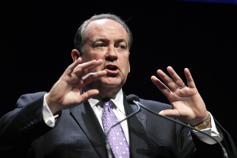 This Aug. 9, 2014, file photo shows Former Arkansas Gov. Mike Huckabee as he speaks during an event in Ames, Iowa. (Photo by Charlie Neibergall/AP)