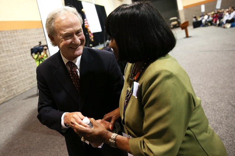 Potential Democratic presidential candidate former Sen. Lincoln Chafee (D-RI) greets a member of the audience after speaking at the South Carolina Democratic Party state convention April 25, 2015 in Columbia, S.C. (Photo by Win McNamee/Getty)