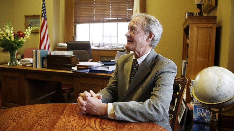 In this photo taken on Tuesday, Nov. 12, 2013, Rhode Island Gov. Lincoln Chafee talks with The Associated Press during an interview at his Statehouse office in Providence, RI. (Photo by Stephan Savoia/AP)