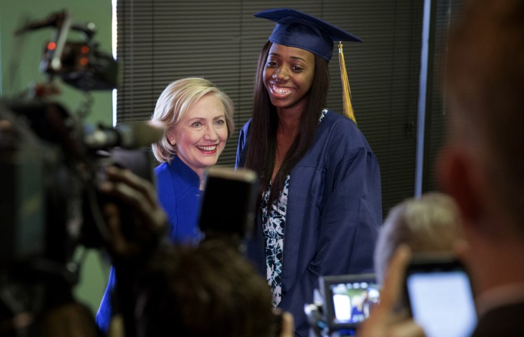 Democratic presidential candidate Hillary Clinton has her picture taken with Keenan High School graduate Dayzjohna Roberts at Kiki's Chicken and Waffles restaurant in Columbia, S.C., May 27, 2015. (Photo by Chris Aluka Berry/Reuters)