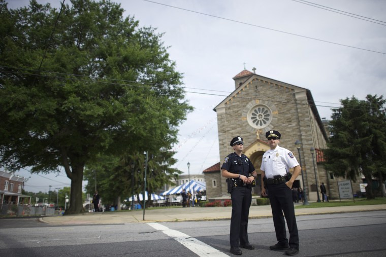 Police officers monitor activity outside St. Anthony of Padua Church before the burial is held for former Delaware Attorney General Beau Biden on June 6, 2015 in Wilmington, Del. (Photo by Mark Makela/Getty)