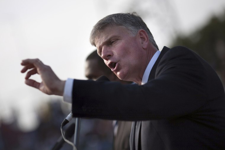 Franklin Graham addresses the crowd at an evangelistic rally  in Port-au-Prince, Jan. 9, 2011. (Photo by Allison Shelley/Reuters)