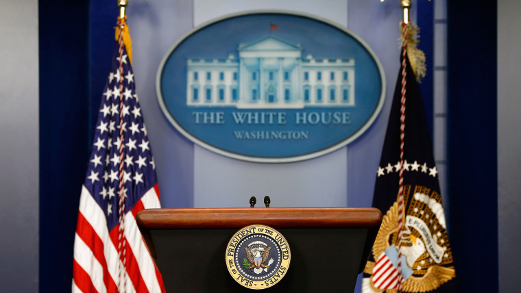 The empty speaker podium in the Brady Press Briefing Room of the White House in Washington, D.C. (Photo by Win McNamee/Getty)