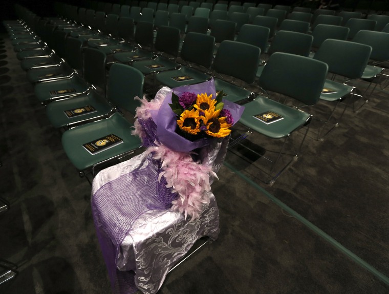 A seat for Hadiya Pendleton is decorated before graduation ceremonies for the Class of 2015 at King College Prep, held on the campus of Chicago State University, June 9, 2015, in Chicago. (Photo by Charles Rex Arbogast/AP)